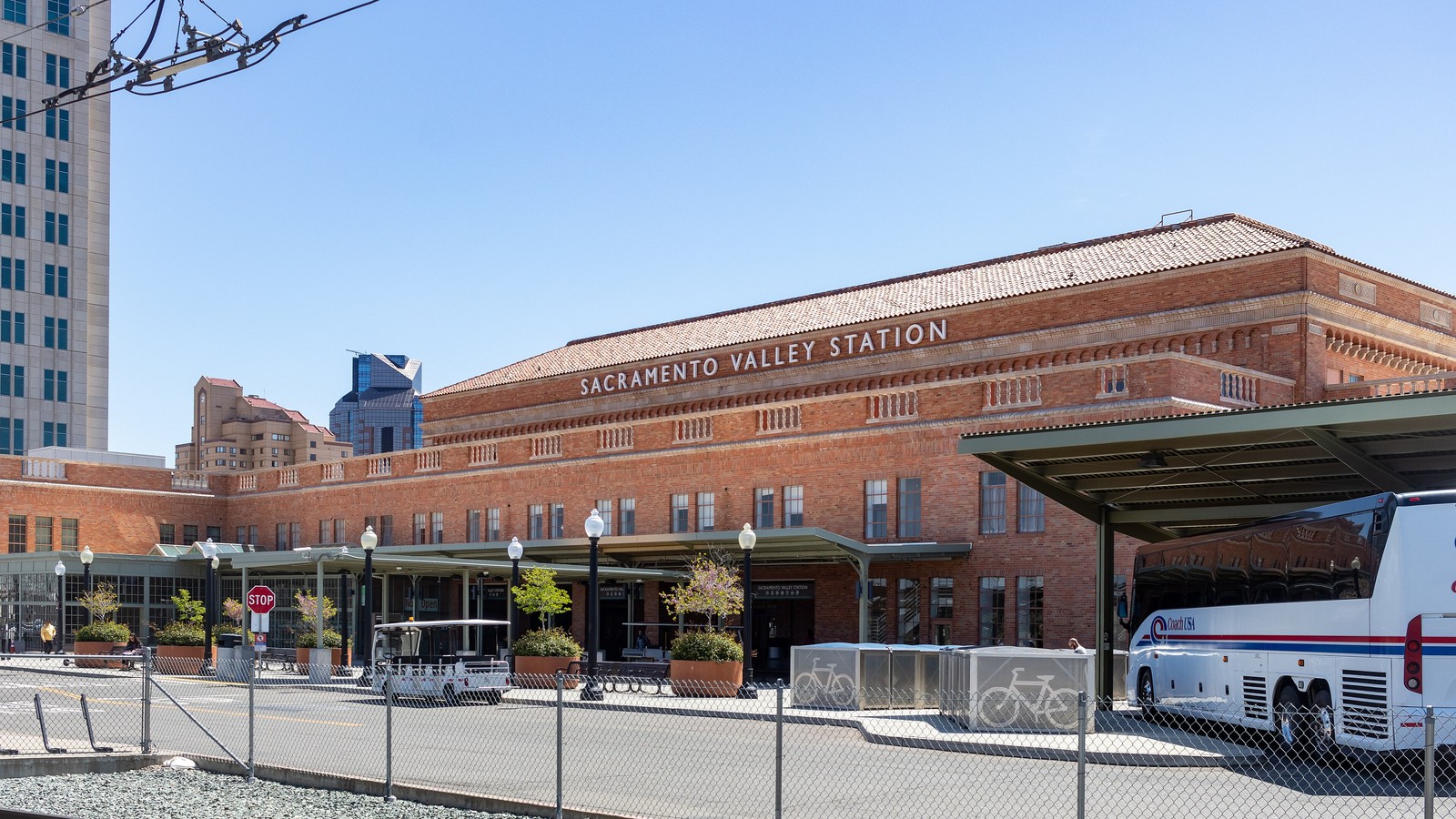 Sacramento Valley Station brick facade with a Thruway bus at the downtown Sacramento terminus