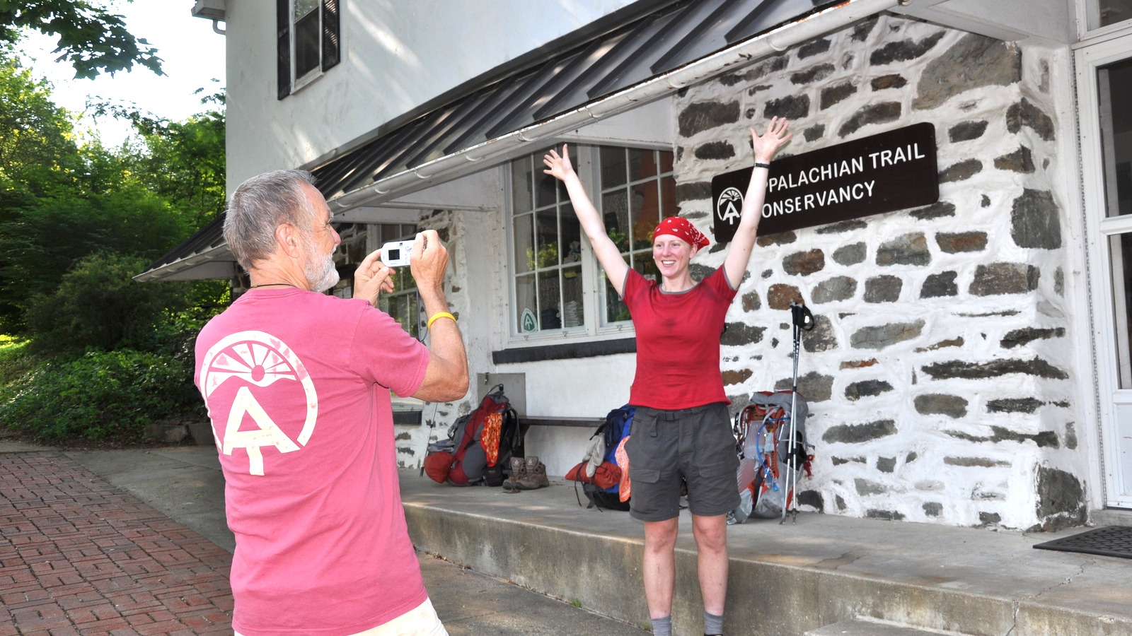 Hiker being photographed at the Appalachian Trail Conservancy Visitor Center in Harpers Ferry