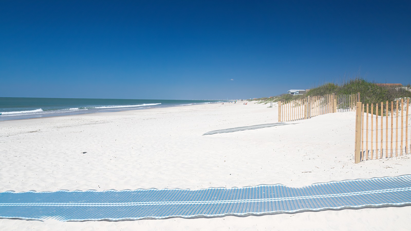White sand, dunes and blue water on Oak Island public beach