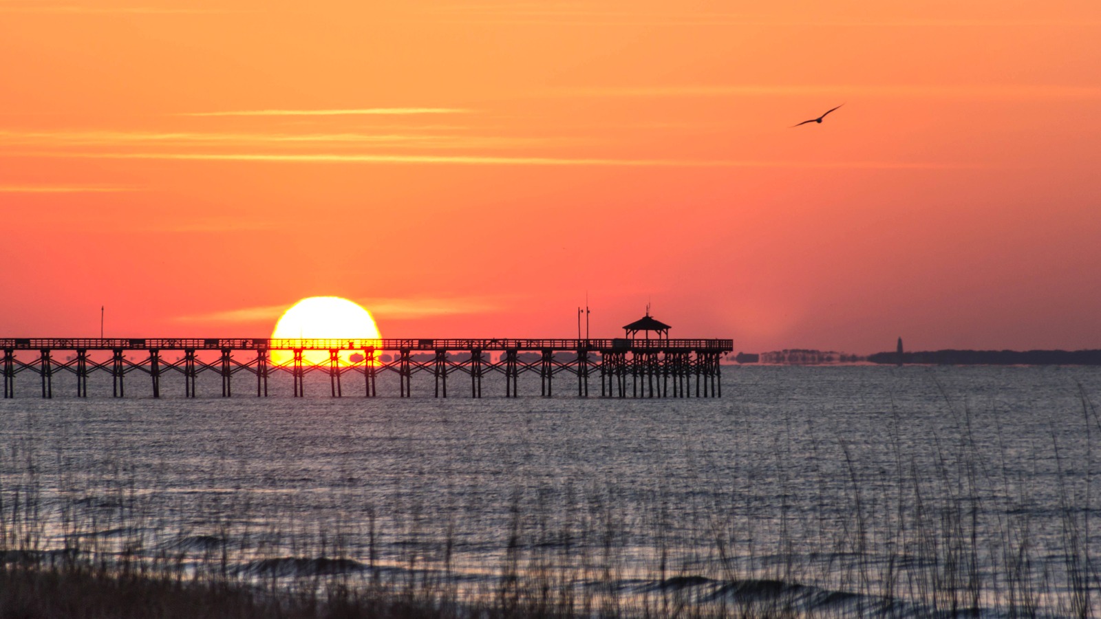 Ocean Crest Fishing Pier extending into the Atlantic at sunset