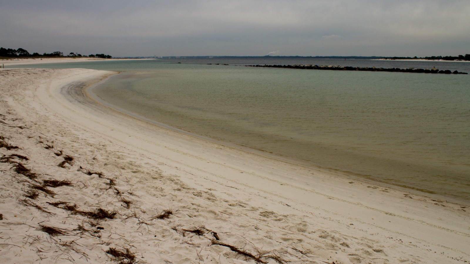 White-sand shoreline and inlet at St. Andrews State Park in Panama City Beach