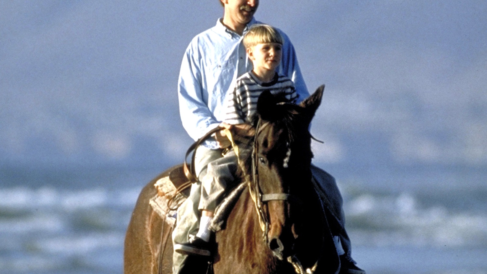 Horseback riders traveling along Pismo Beach