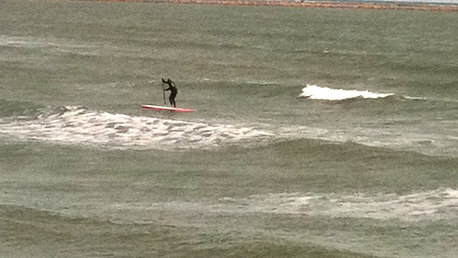 Surfer riding a wave at Port Aransas