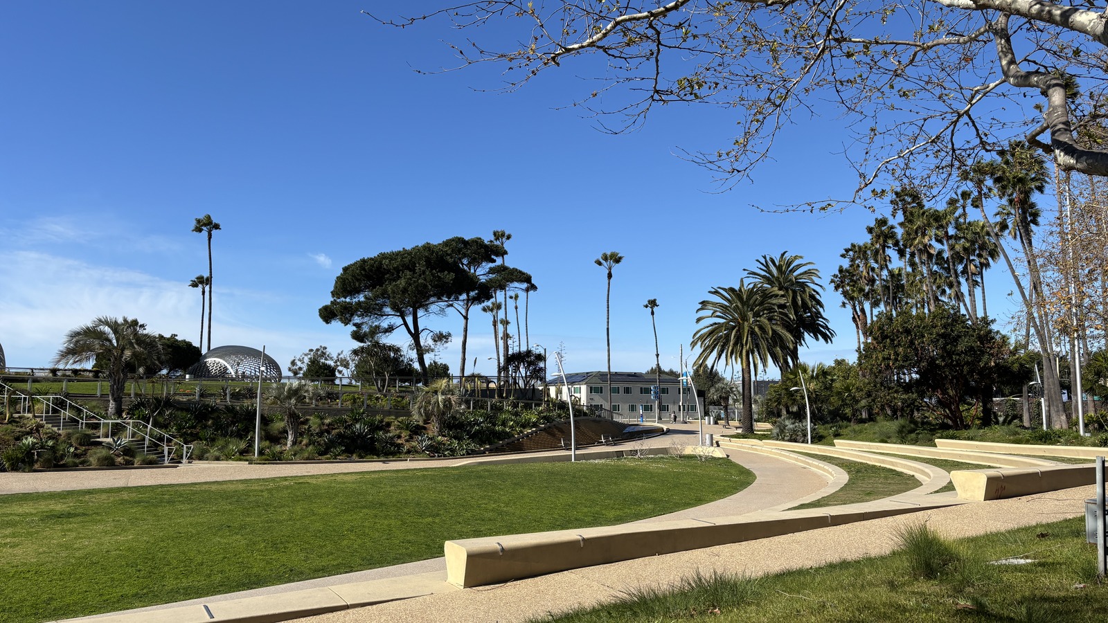 Landscaped paths and modern structures in Tongva Park