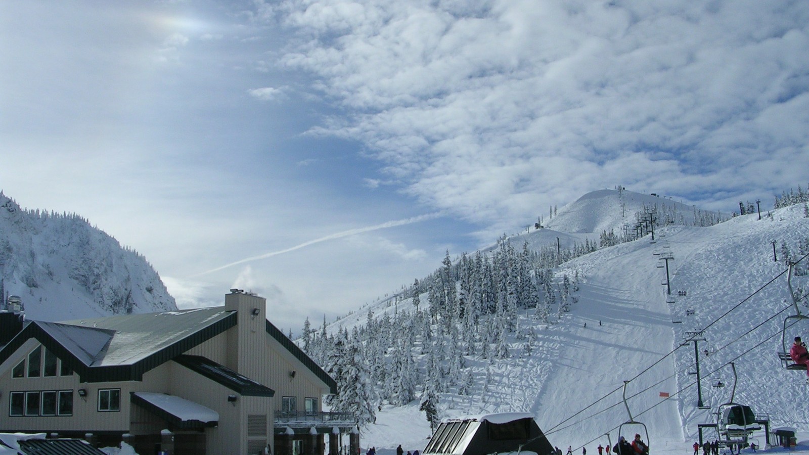 Snowy lodge and slopes at Hoodoo Ski Area