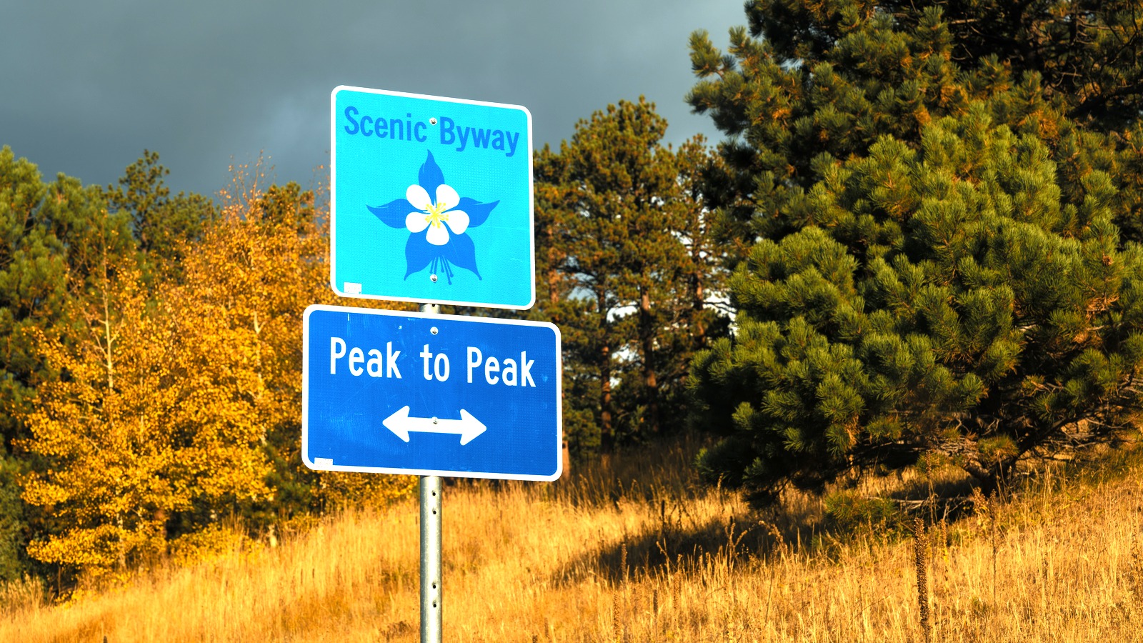 Peak to Peak Scenic Byway sign on SH 119 between Rollinsville and Nederland, Colorado