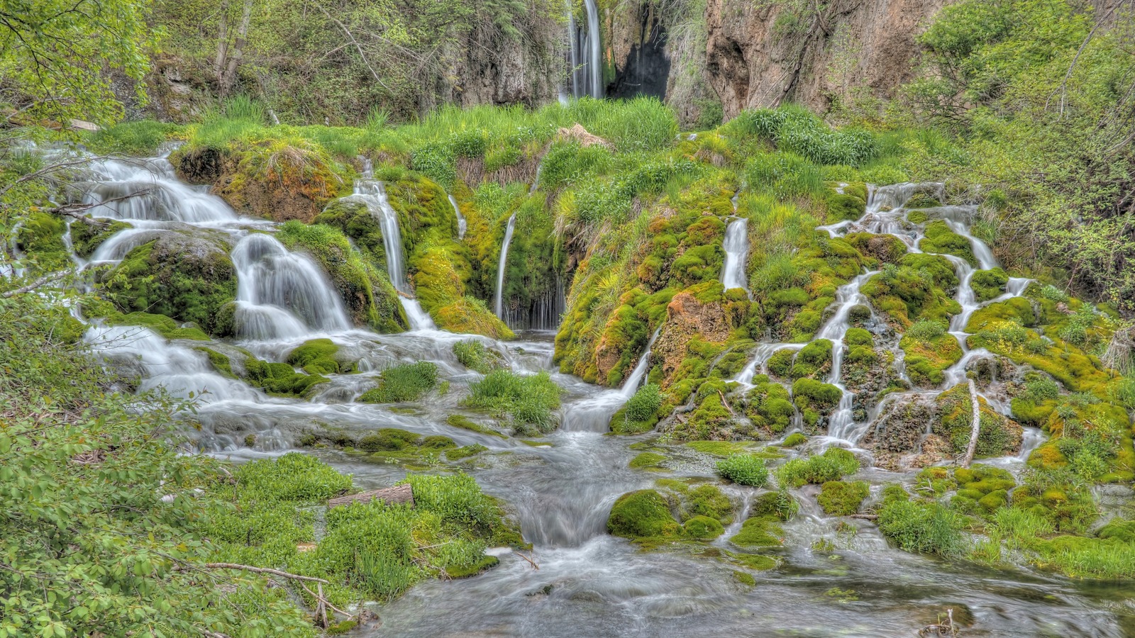 Roughlock Falls cascades over moss-covered ledges on Little Spearfish Creek in South Dakota