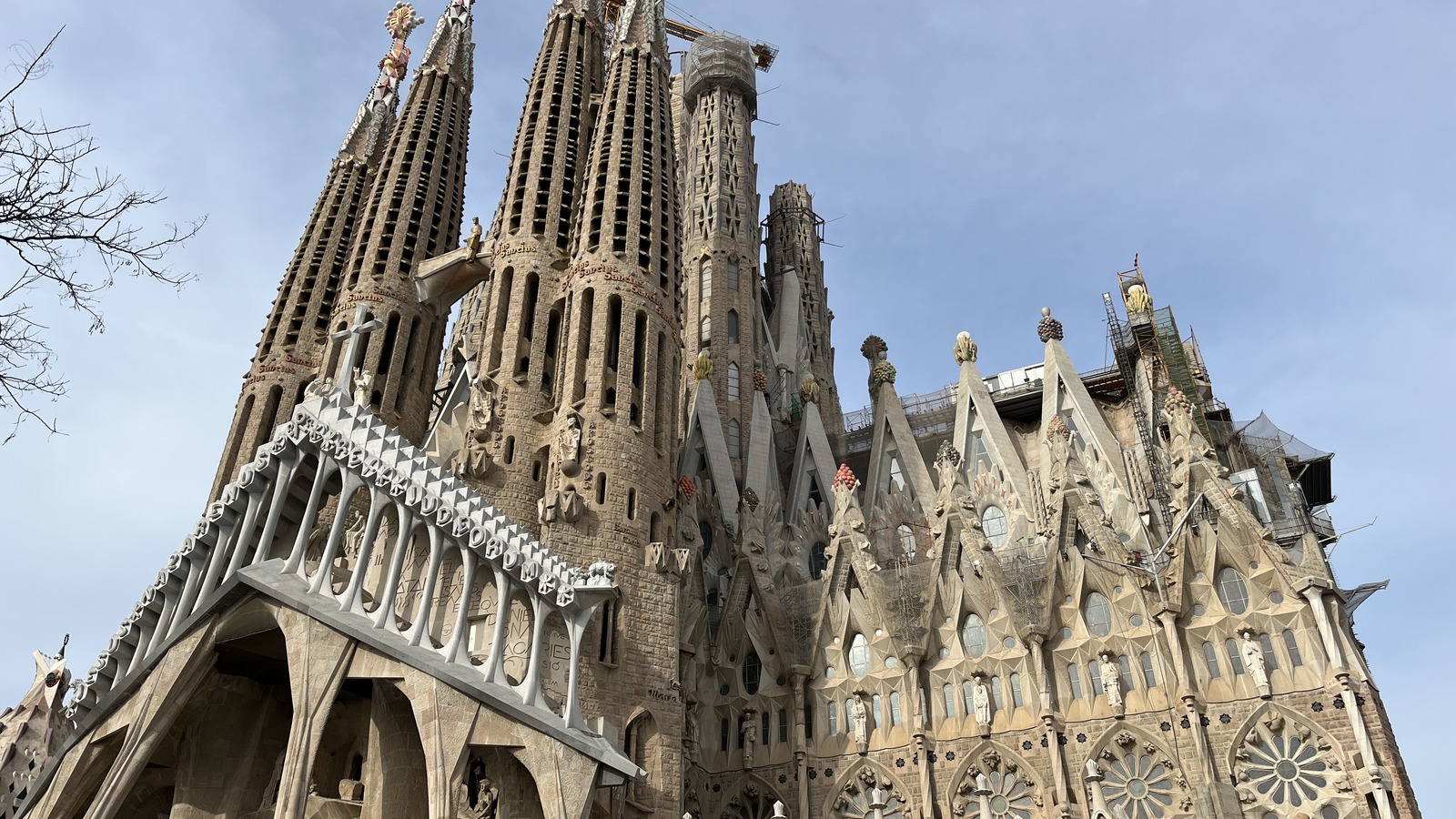 The carved stone Nativity facade and spires of the Sagrada Familia basilica in Barcelona