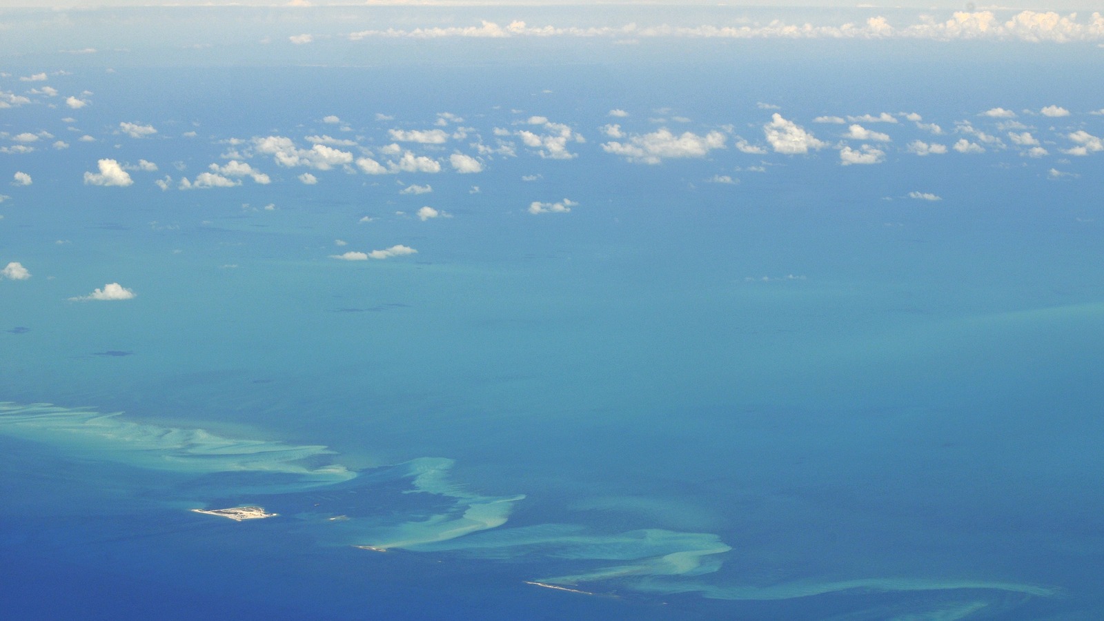 Aerial view of the two Bimini islands in the Bahamas ringed by bright turquoise shallows