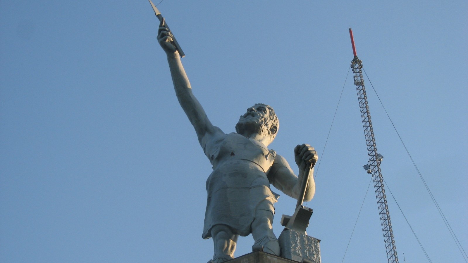 The cast iron Vulcan statue holding hammer and spear point above Birmingham, Alabama