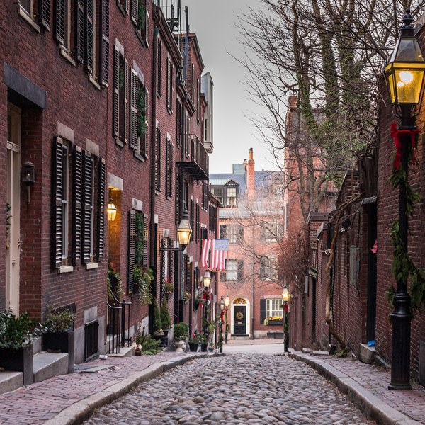 Brick homes and cobblestones along Acorn Street in Boston's Beacon Hill neighborhood