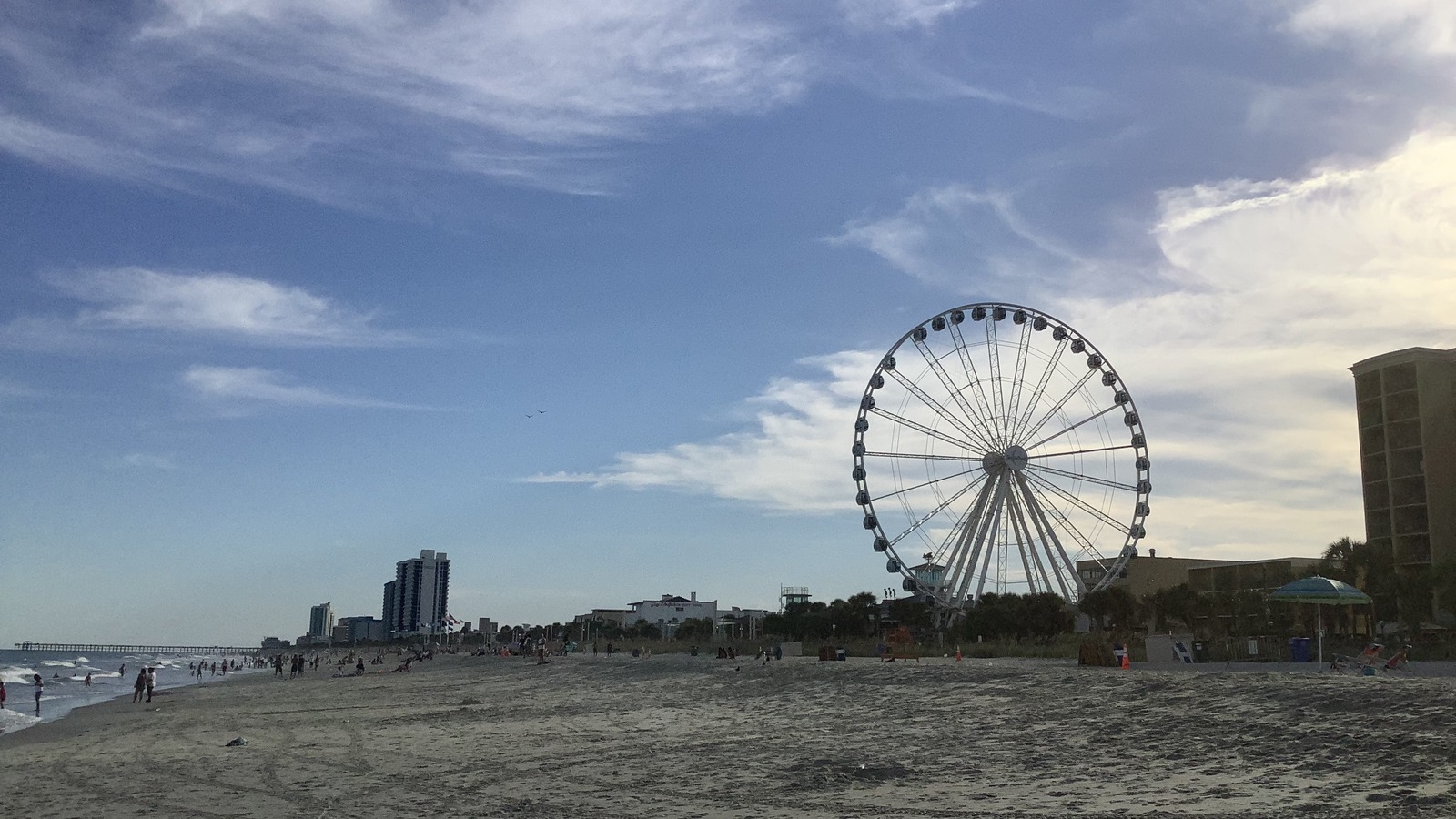 The Myrtle Beach SkyWheel rising above the beach and oceanfront in South Carolina