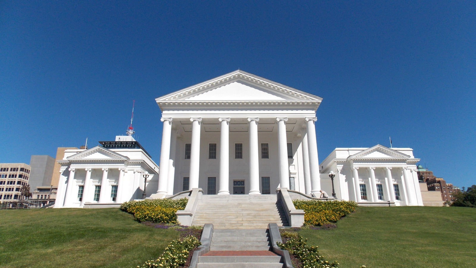 The white columned portico of the Virginia State Capitol above its lawn in Richmond, Virginia
