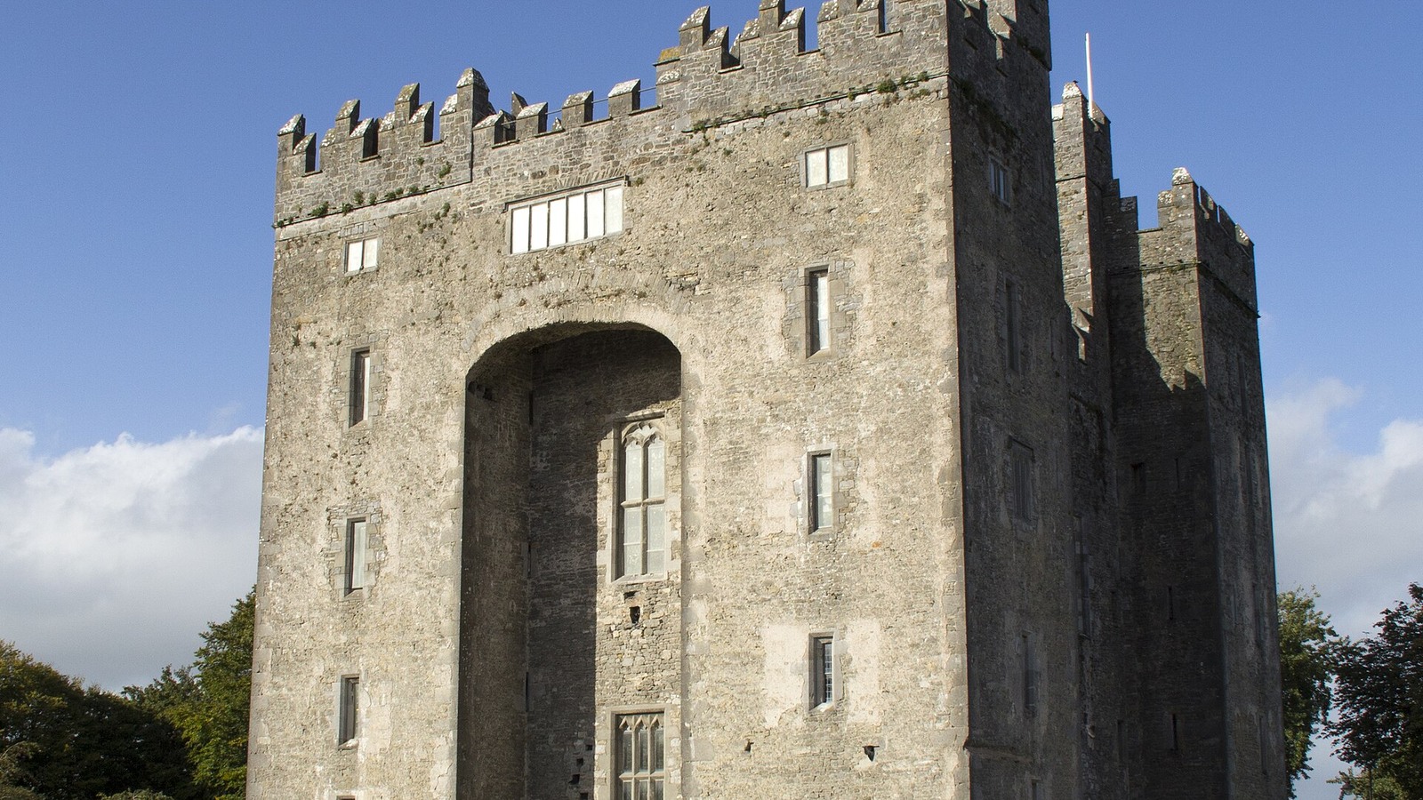 Bunratty Castle rising above its green grounds in County Clare