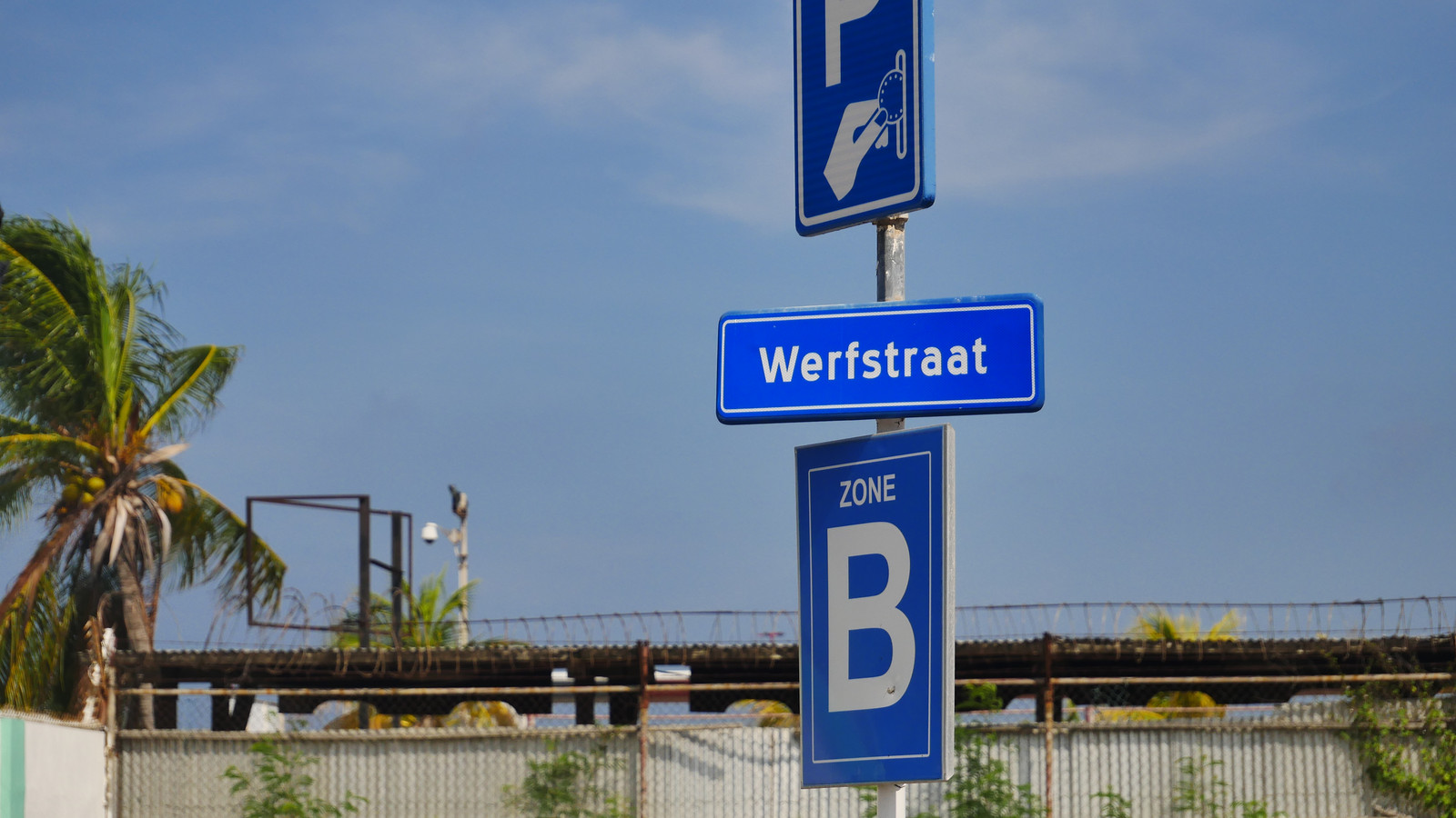 Paid parking and Werfstraat signs in downtown Oranjestad, Aruba
