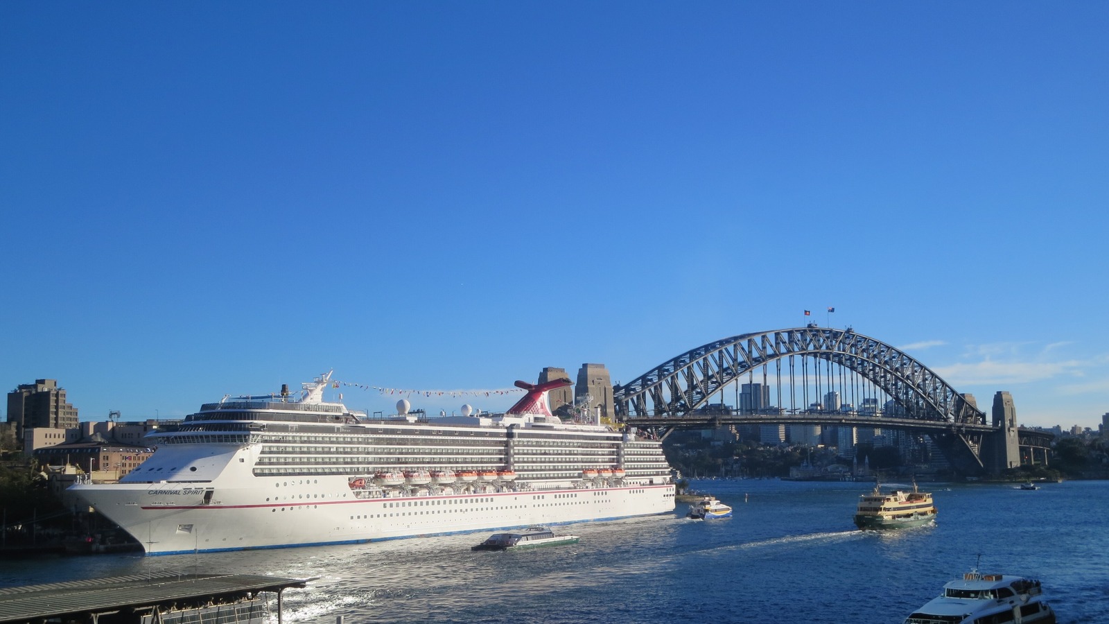 Carnival Spirit docked at Sydney Cove with Sydney Harbour Bridge behind it