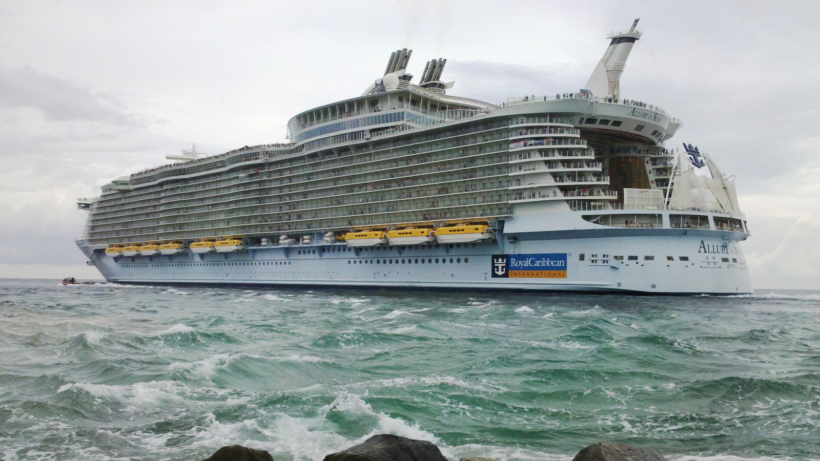 Allure of the Seas leaving Port Everglades in Fort Lauderdale, with the ship name visible on the bow