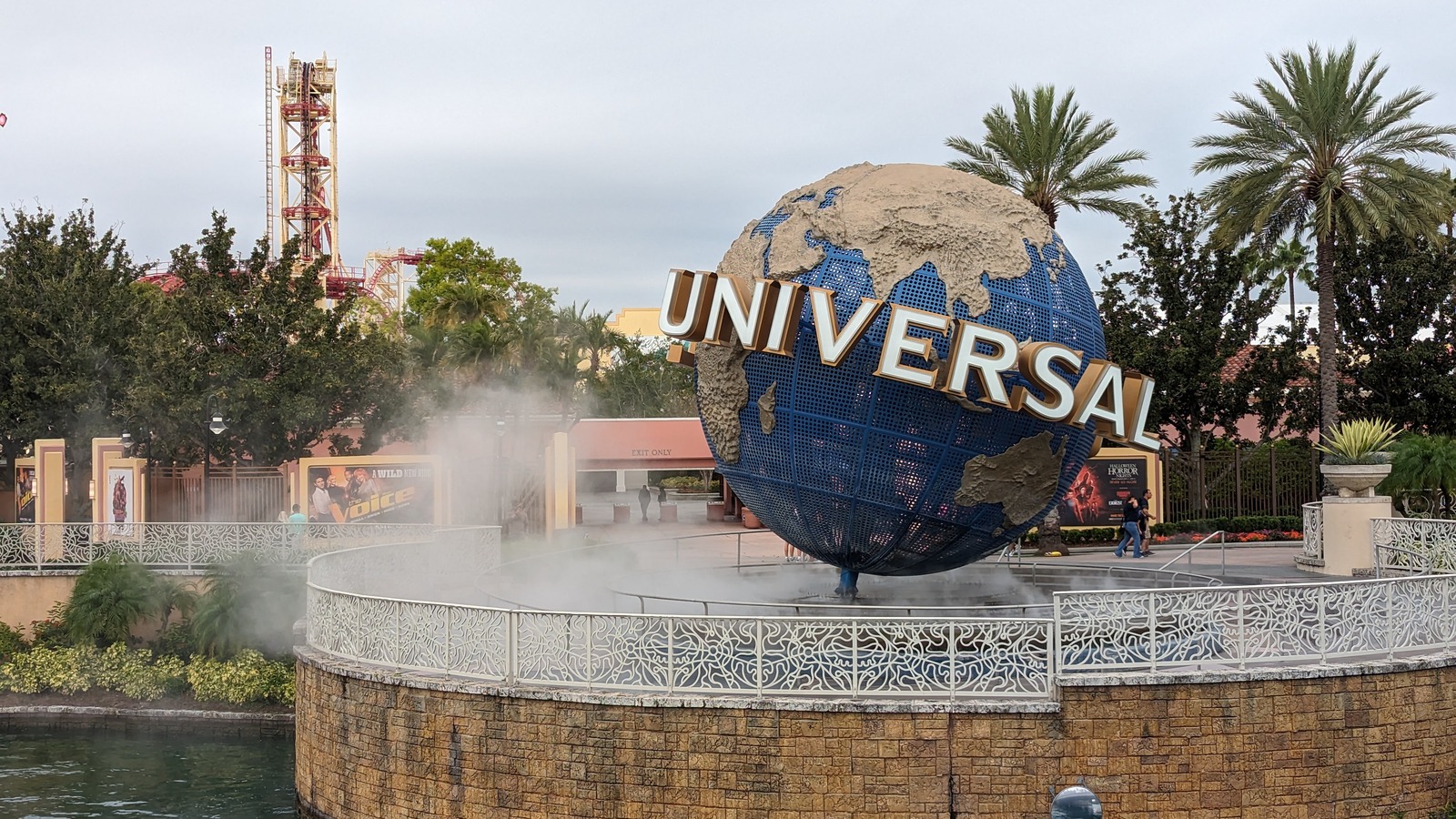 Universal Studios Florida entrance globe with misting fountain and palm trees