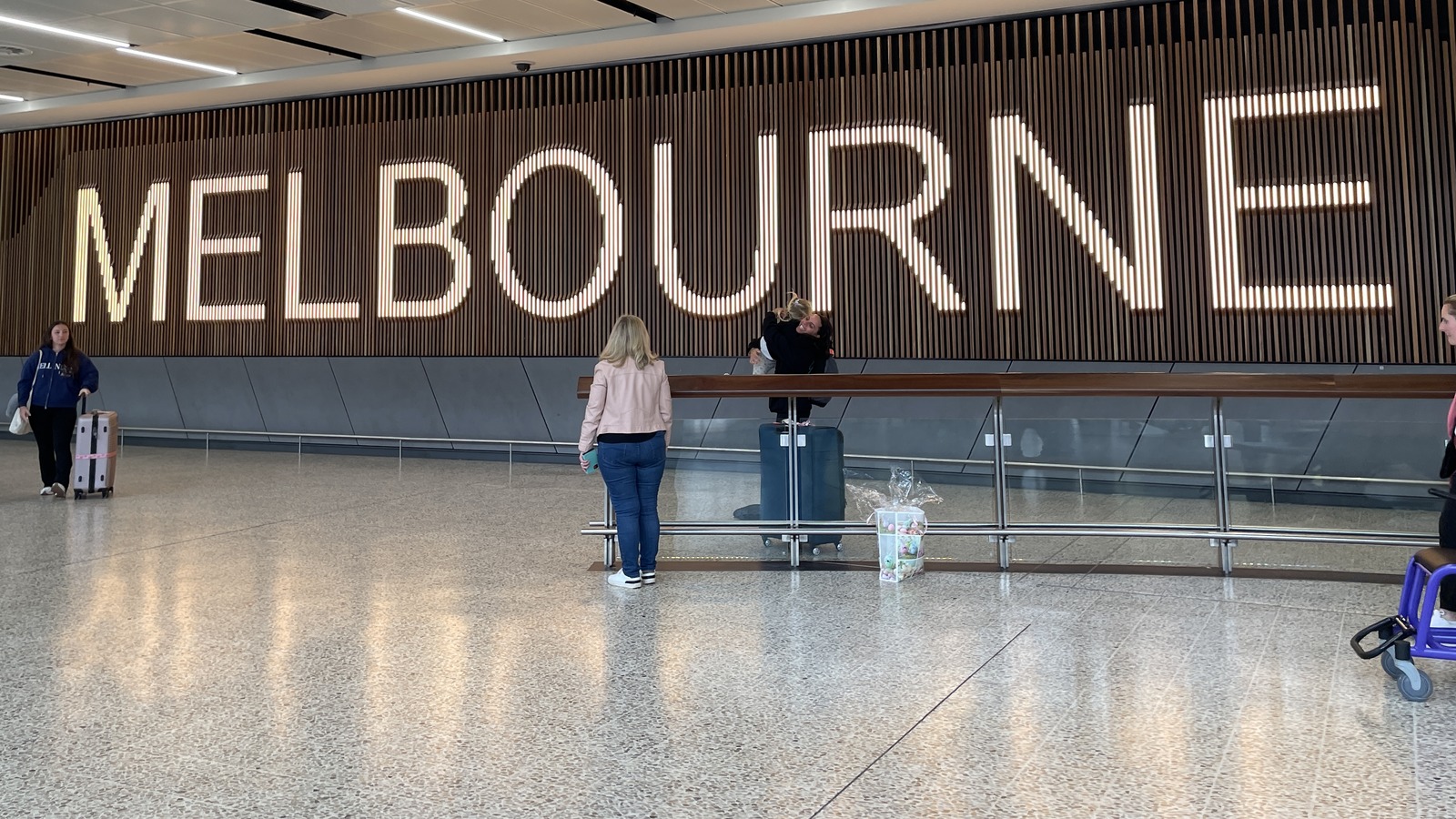 Melbourne Airport Terminal 2 interior with illuminated Melbourne signage in May 2025