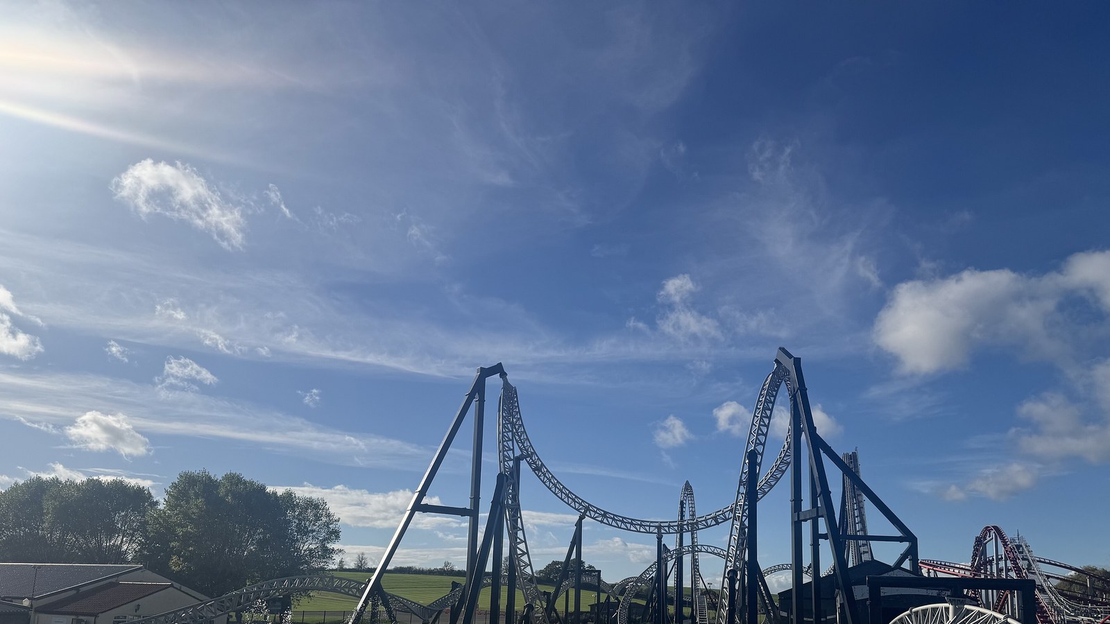 The Sik roller coaster track against a blue sky at Flamingo Land in October 2025; the Halloween event is not shown