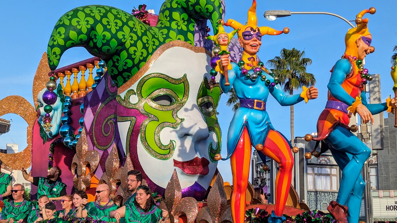 Daytime Mardi Gras parade float at Universal Studios Florida with costumed performers