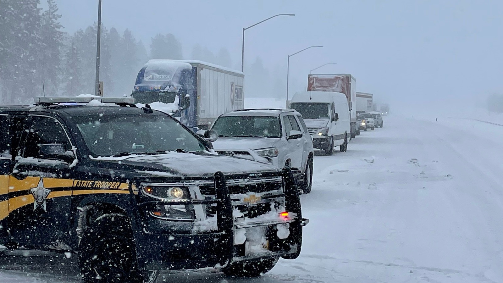 An Oregon State Police trooper blocks traffic on a closed section of Interstate 84 in eastern Oregon