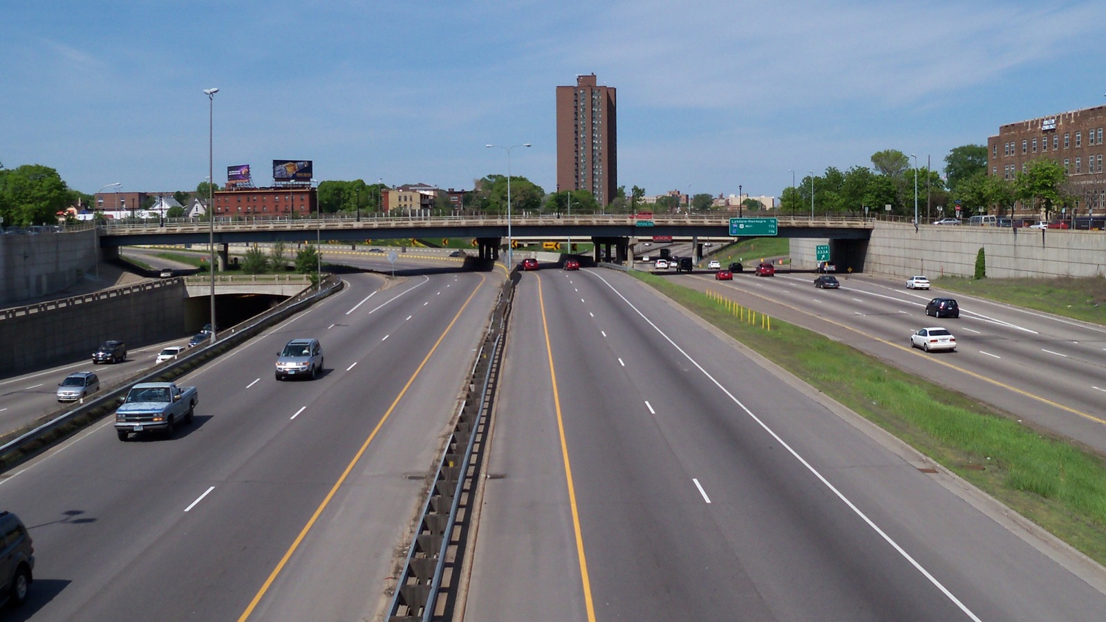 Interstate 94 and Interstate 35W lanes in downtown Minneapolis viewed from an overpass on a clear day