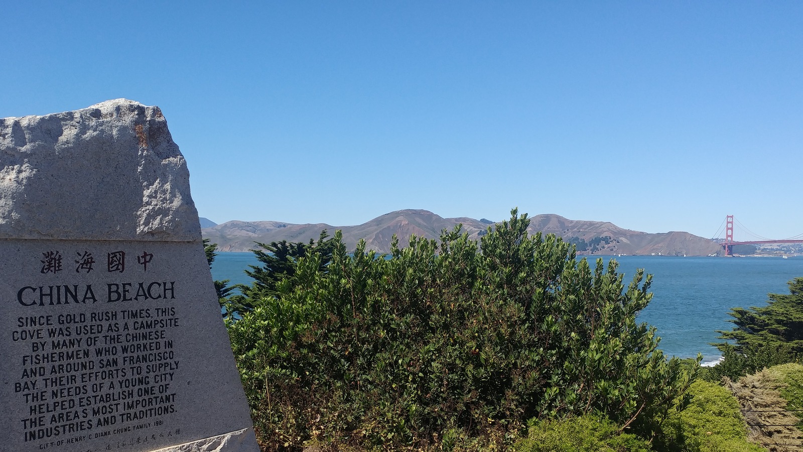 China Beach monument with San Francisco Bay and the Golden Gate Bridge in the distance