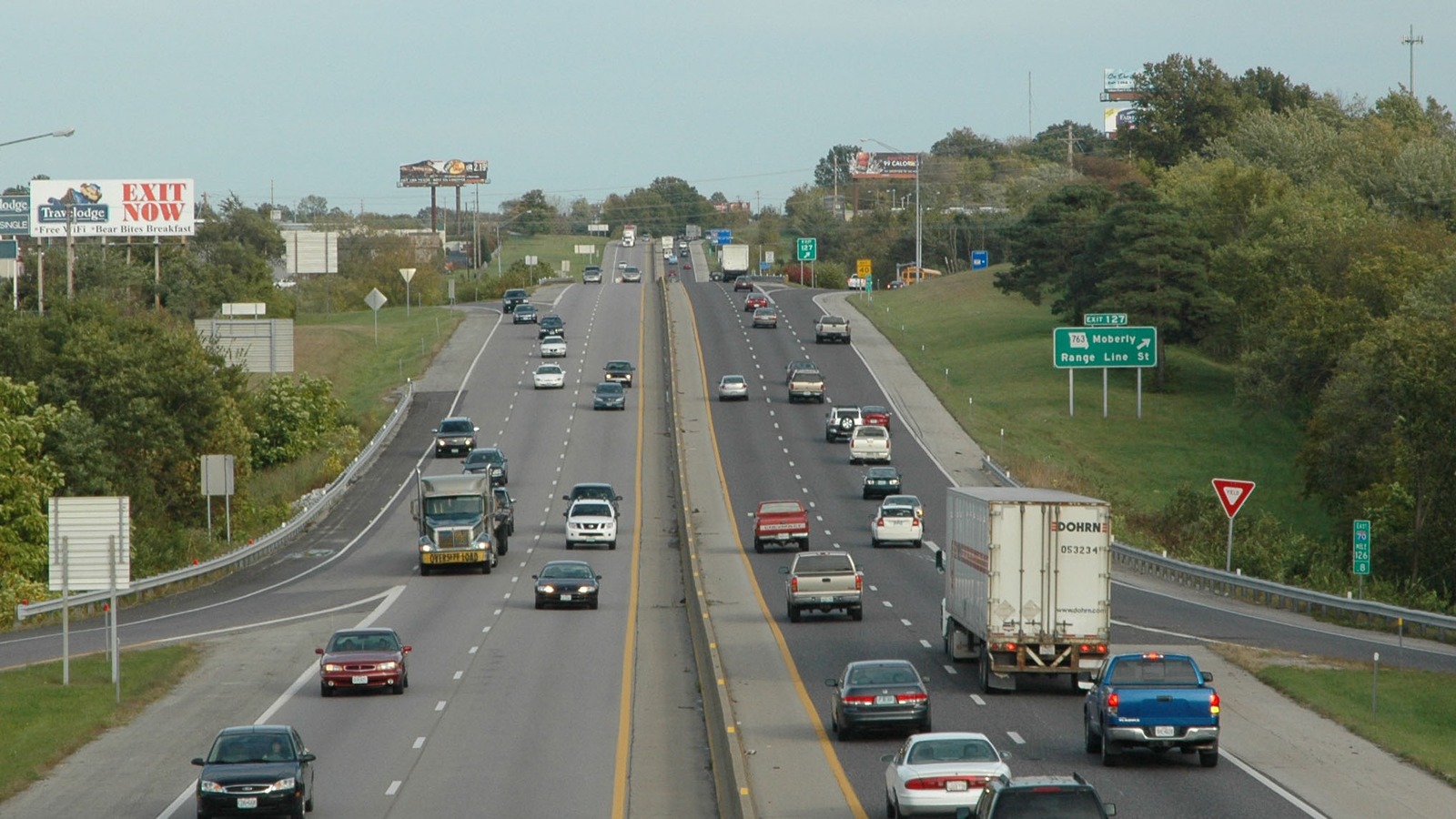 Cars traveling on Interstate 70 in Missouri under clear skies