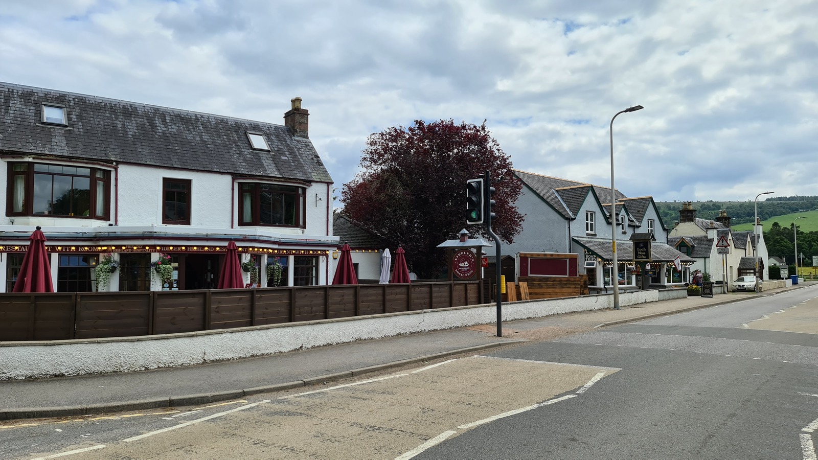 The A82 running through Drumnadrochit village, the nearest settlement north of the Grotaig rock-slope works on Loch Ness.