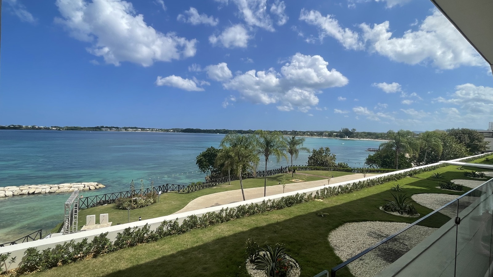 Bloody Bay beach and resort grounds seen from Royalton Negril in Jamaica under a bright sky