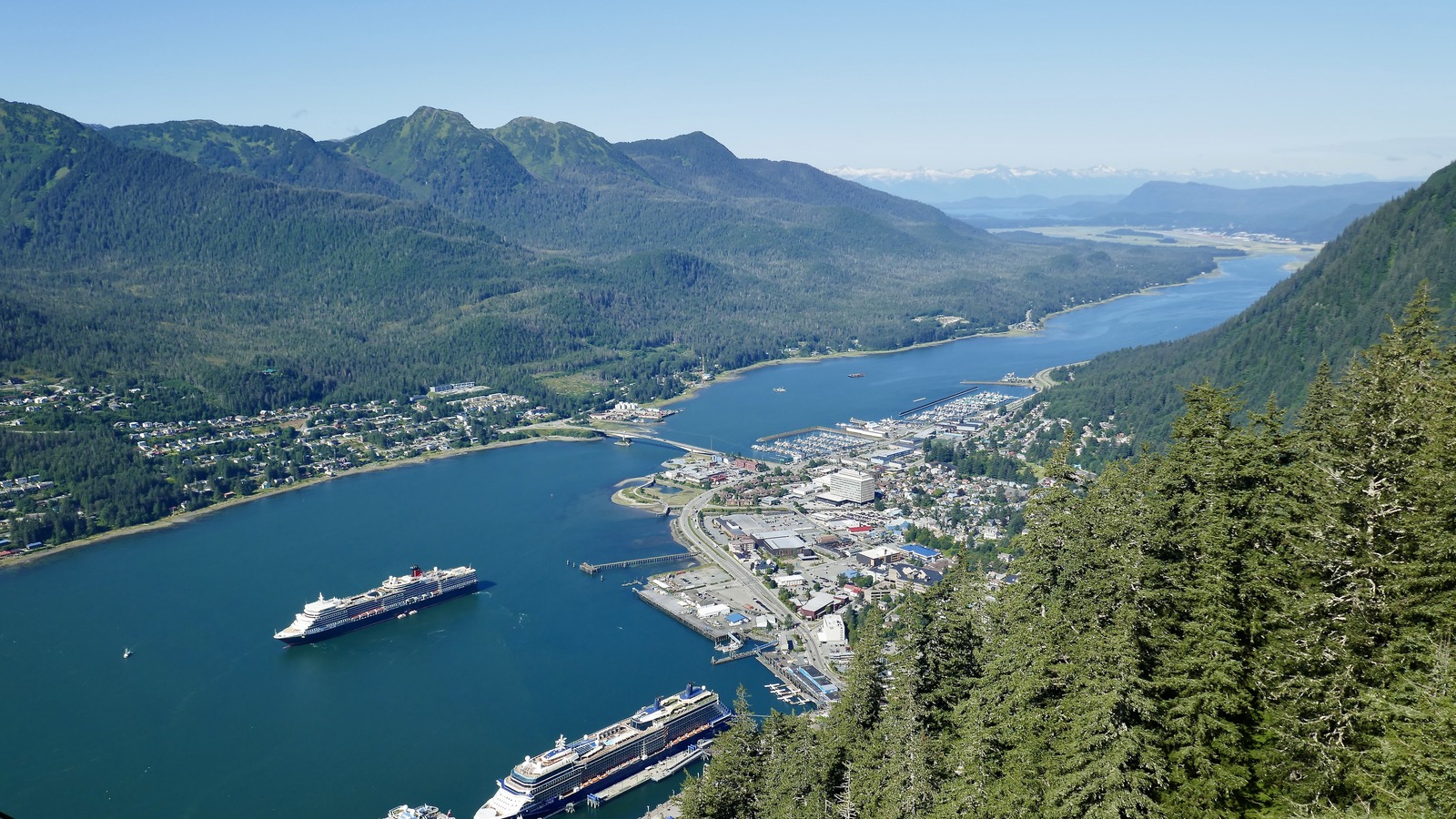 Cunard Queen Elizabeth at anchor off Juneau, Alaska, with downtown and harbor in view