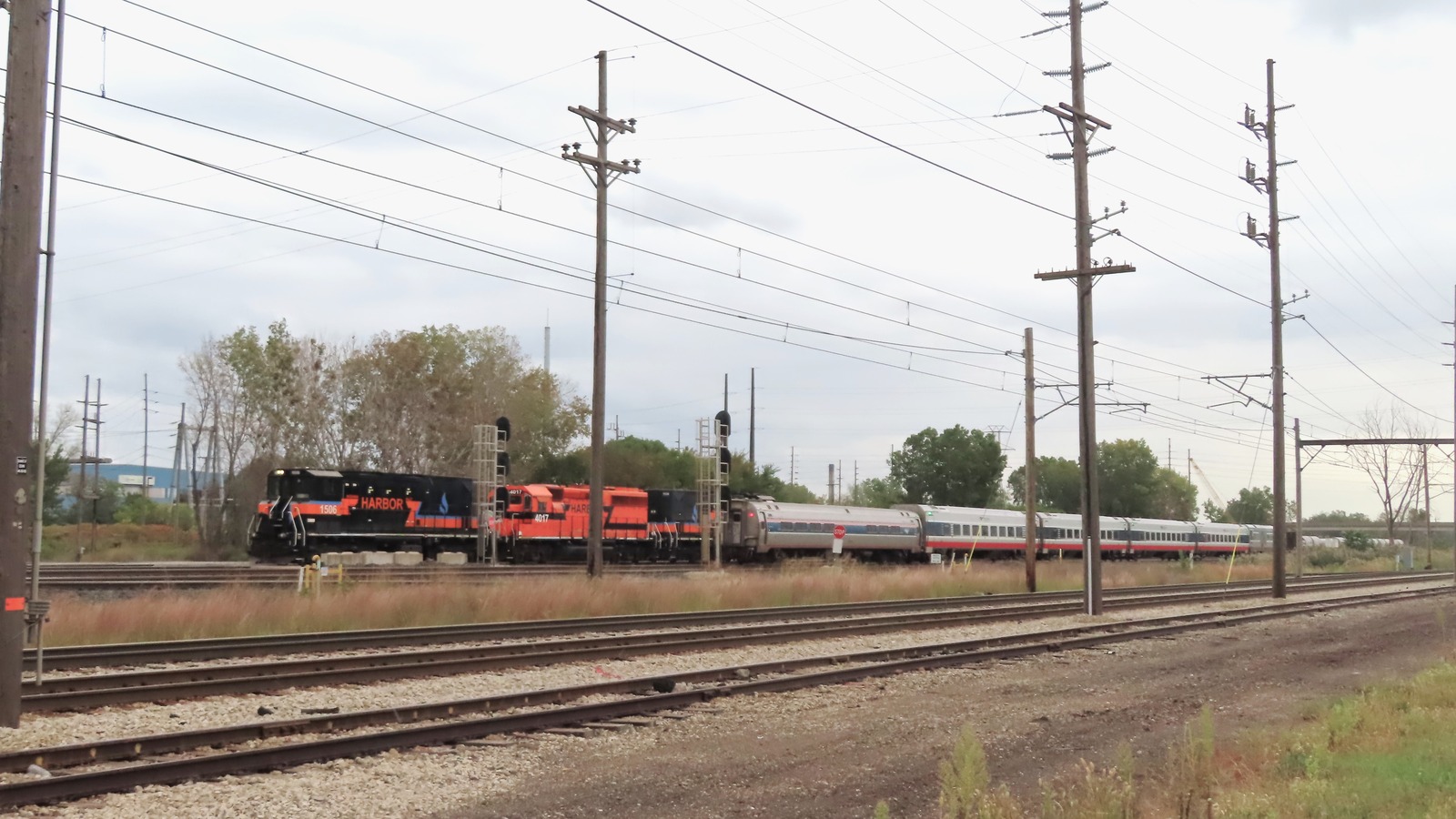 Eastbound Amtrak Wolverine passenger train passing through Portage, Indiana in daylight