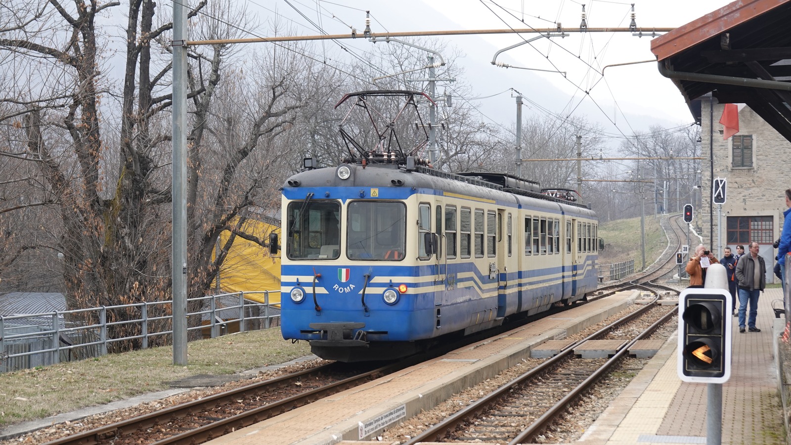 Blue and cream Centovalli line train at Trontano station in February 2026