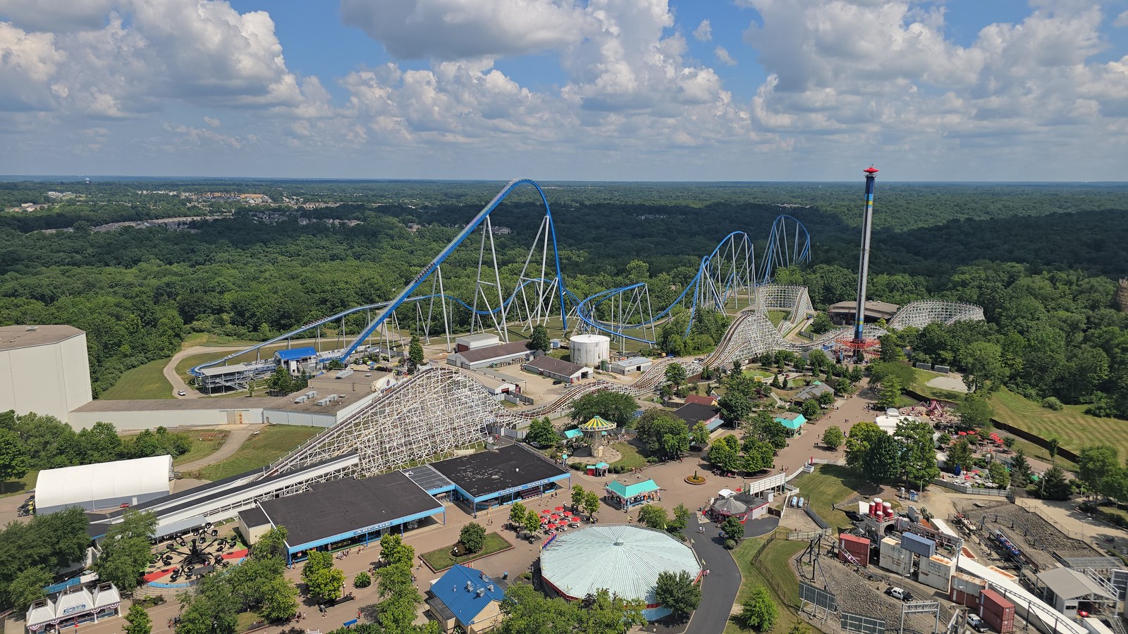 An aerial view over Kings Island in Mason, Ohio, showing the Diamondback coaster, the wooden Racer and the park midway