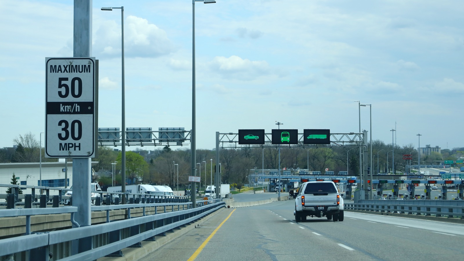Vehicles approach Canadian customs at the Blue Water Bridge in Sarnia, Ontario, photographed April 2023