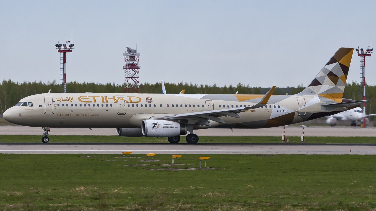 Etihad Airways Airbus A321 registration A6-AEJ taxiing in the airline's tan fuselage and geometric tail livery
