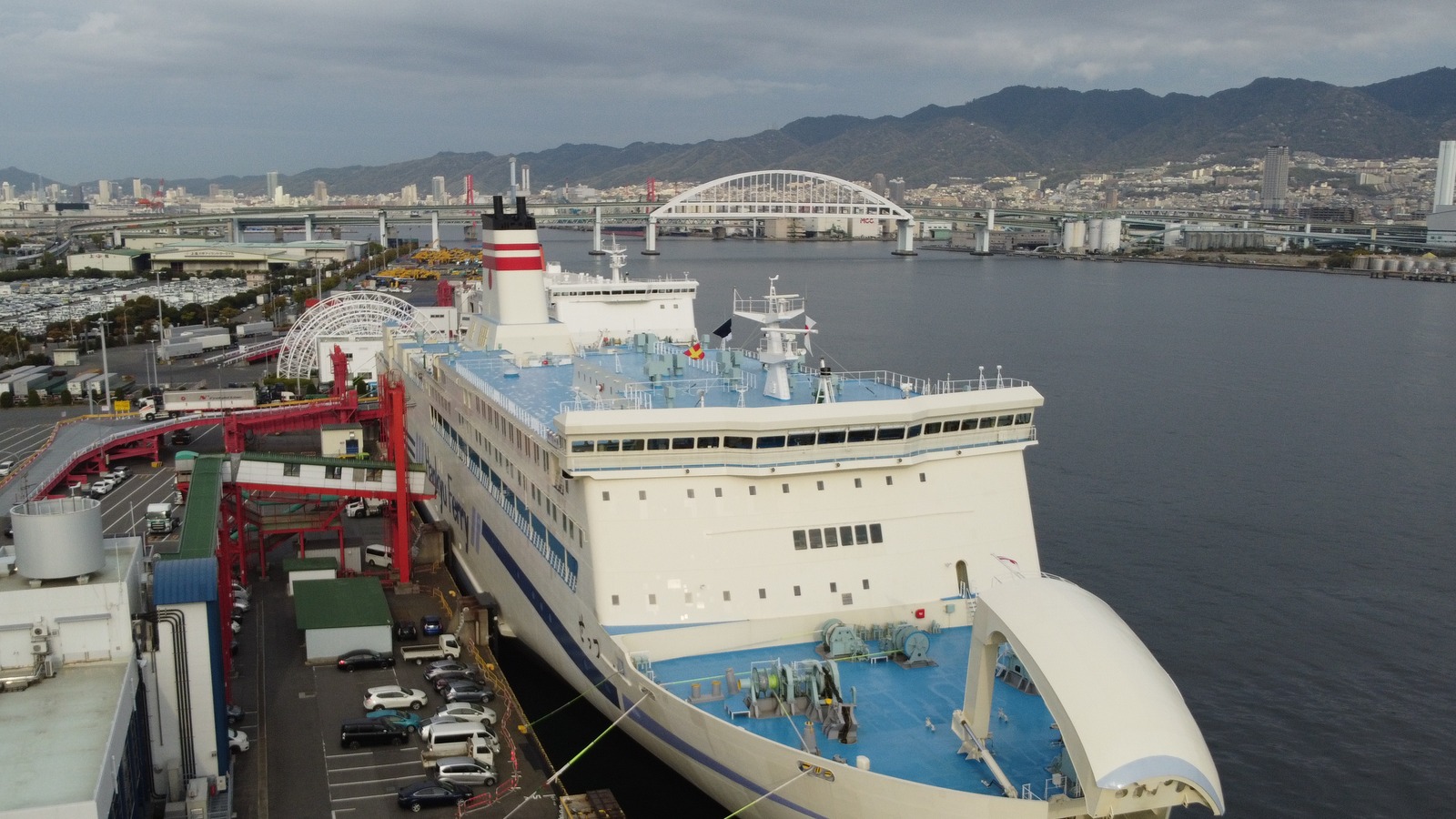 Aerial view of Hankyu Ferry ship Settsu docked at the Kobe Rokko Island ferry terminal