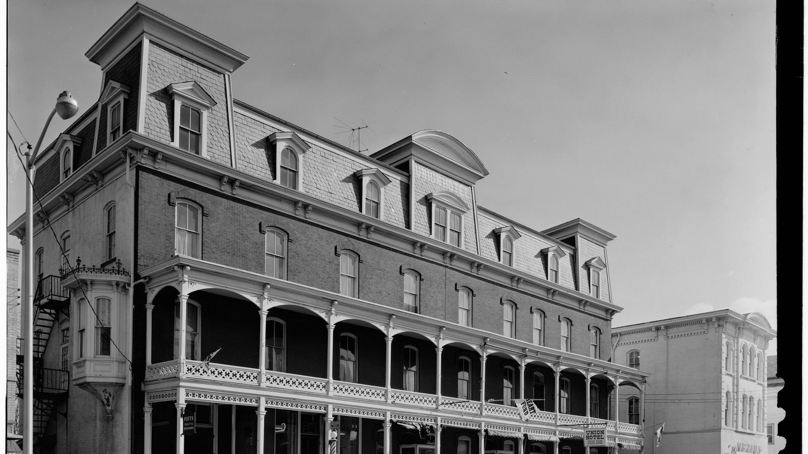 The Union Hotel on Main Street in Flemington, New Jersey, in a 1963 Historic American Buildings Survey photograph, showing the Victorian brick facade, mansard roof, and two-story porch.