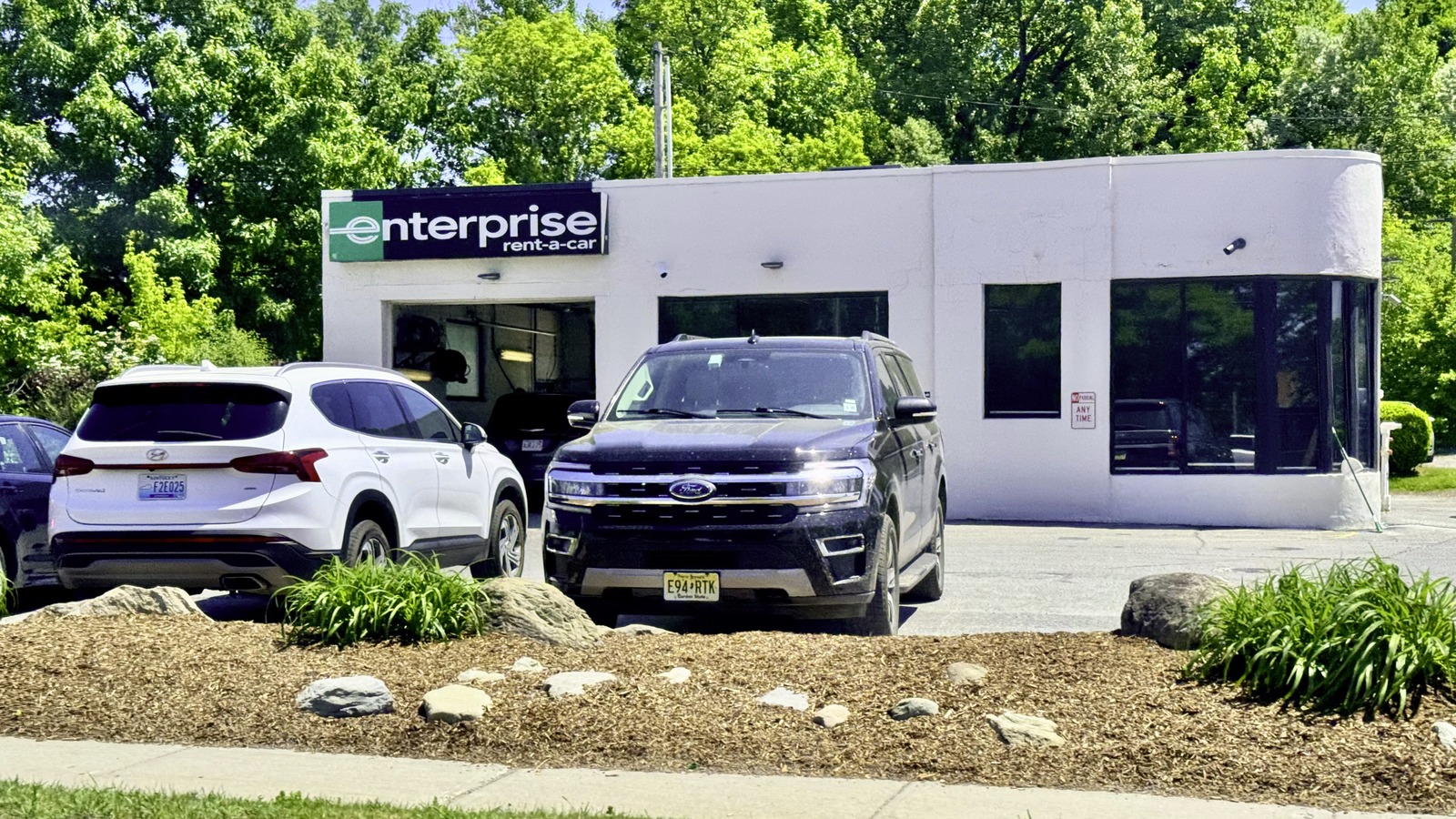 Enterprise Rent-A-Car branch and parked vehicles in South Burlington, Vermont, photographed in June 2024; local promotional eligibility varies by date