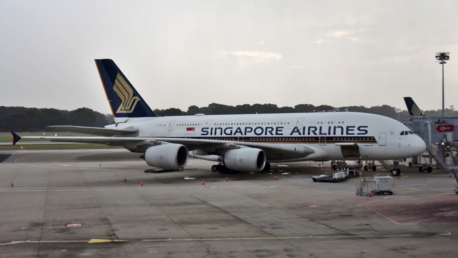 Singapore Airlines Airbus A380 aircraft parked at a gate at Changi Airport