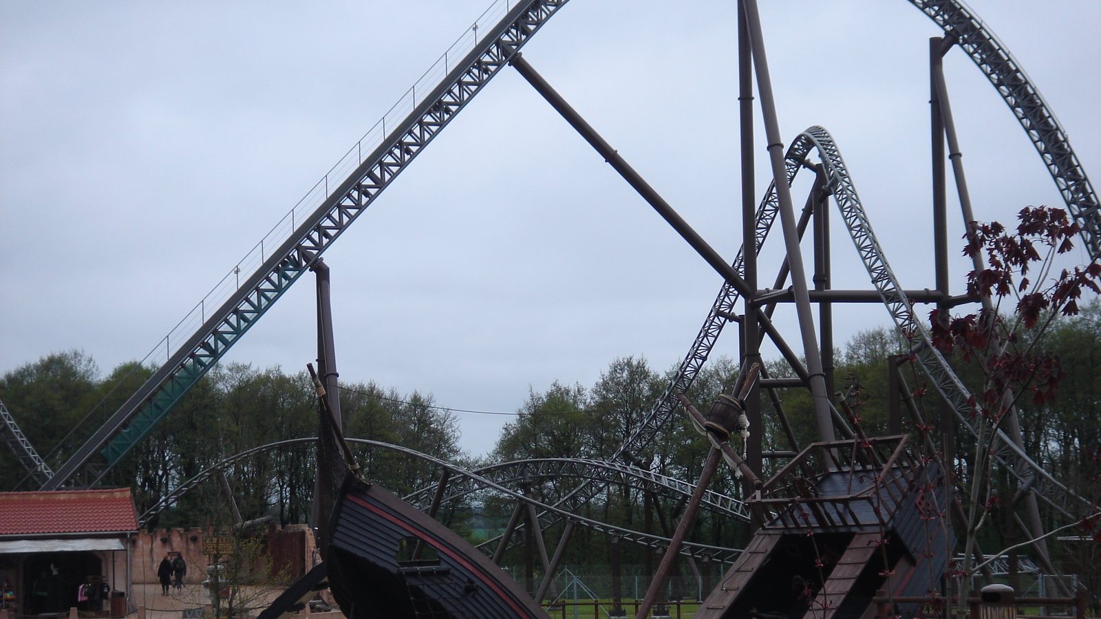 The Piraten roller coaster track and pirate ship theming at Djurs Sommerland under a grey sky in May 2010; the Halloween event is not shown