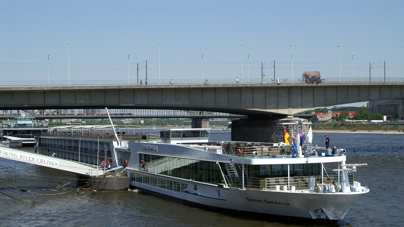 Scenic Emerald river cruise ship on the Rhine in Cologne beside a Viking River Cruises vessel