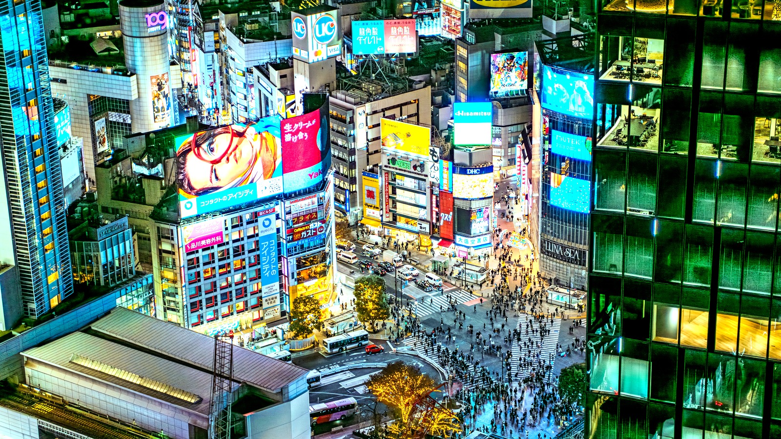 Aerial view of Shibuya crossing and surrounding Tokyo shopping district in daylight