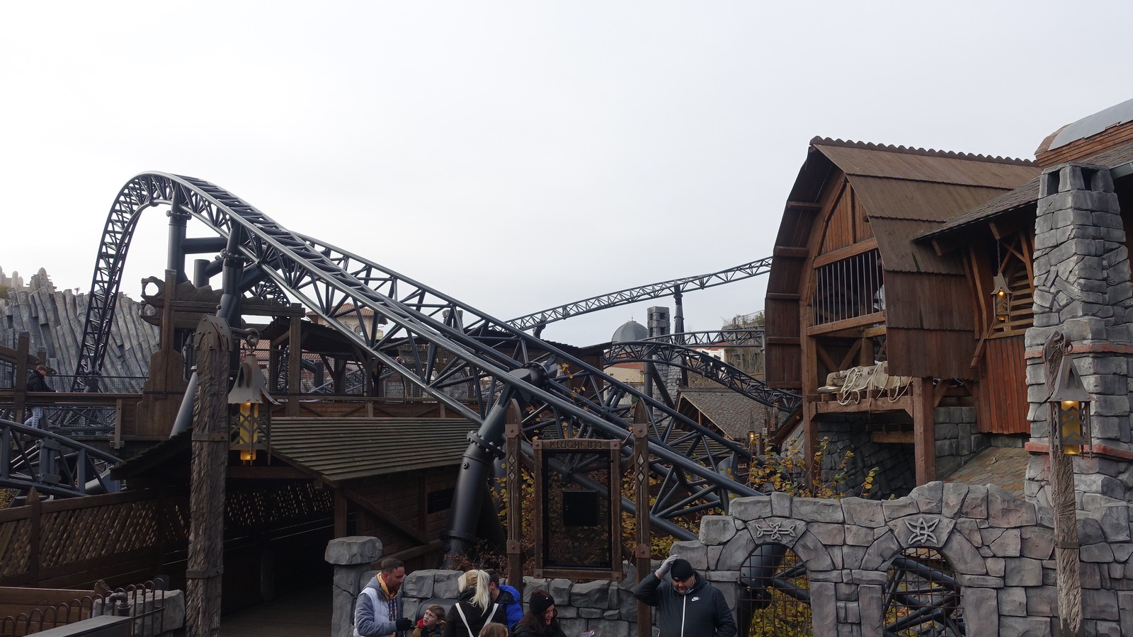 Taron roller coaster track winding through Klugheim buildings at Phantasialand in a contextual November 2021 photograph