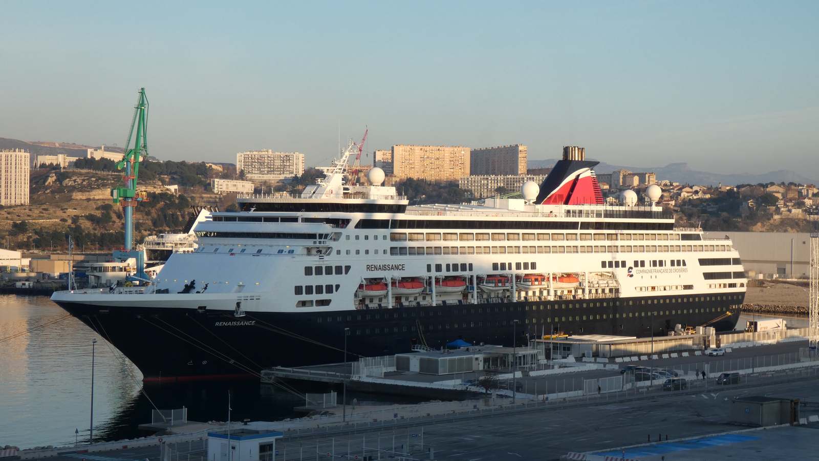 Cruise ship Renaissance docked at a port, with the name Renaissance visible on the hull