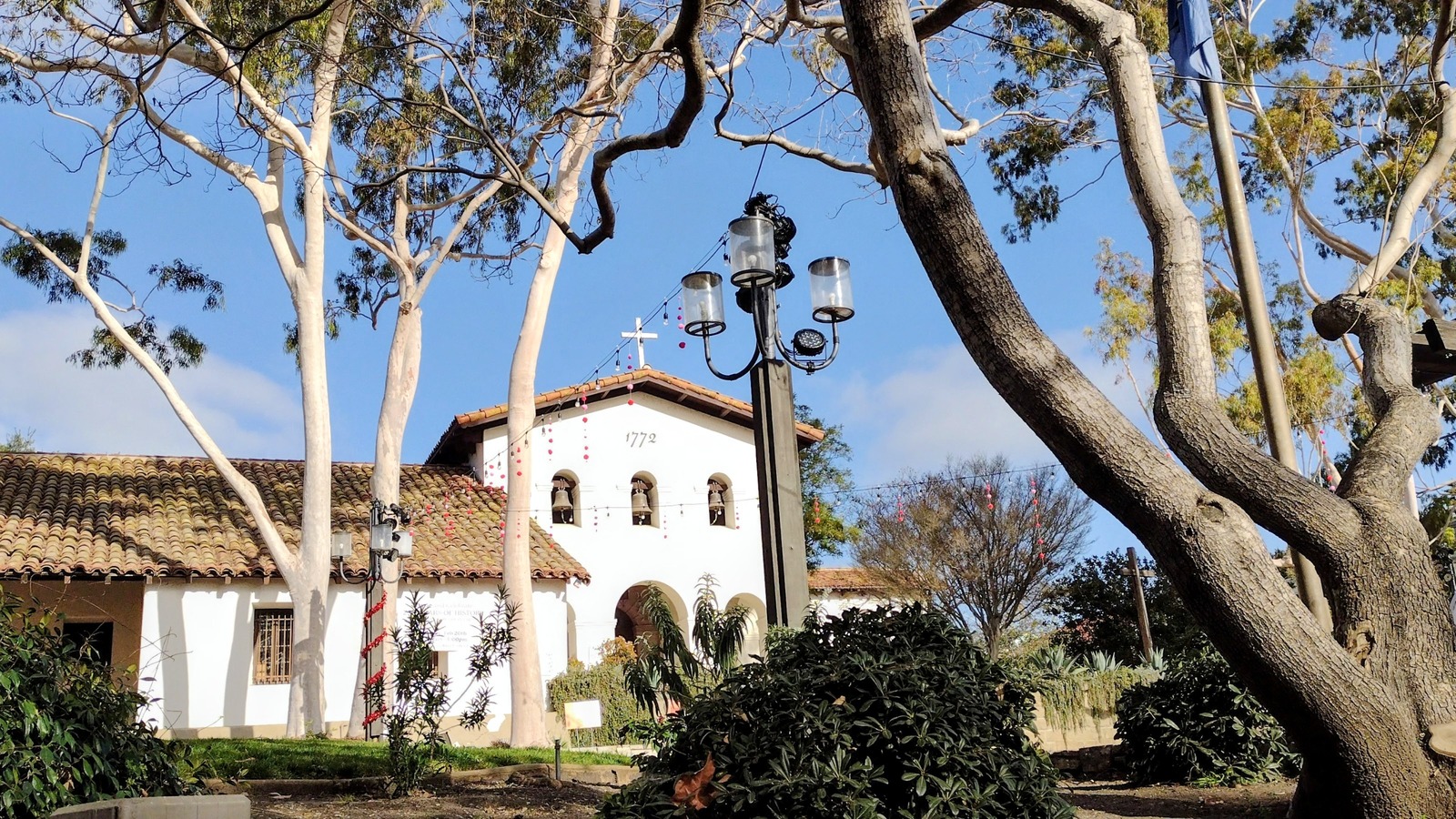Mission San Luis Obispo bell tower and grounds, photographed in February 2022