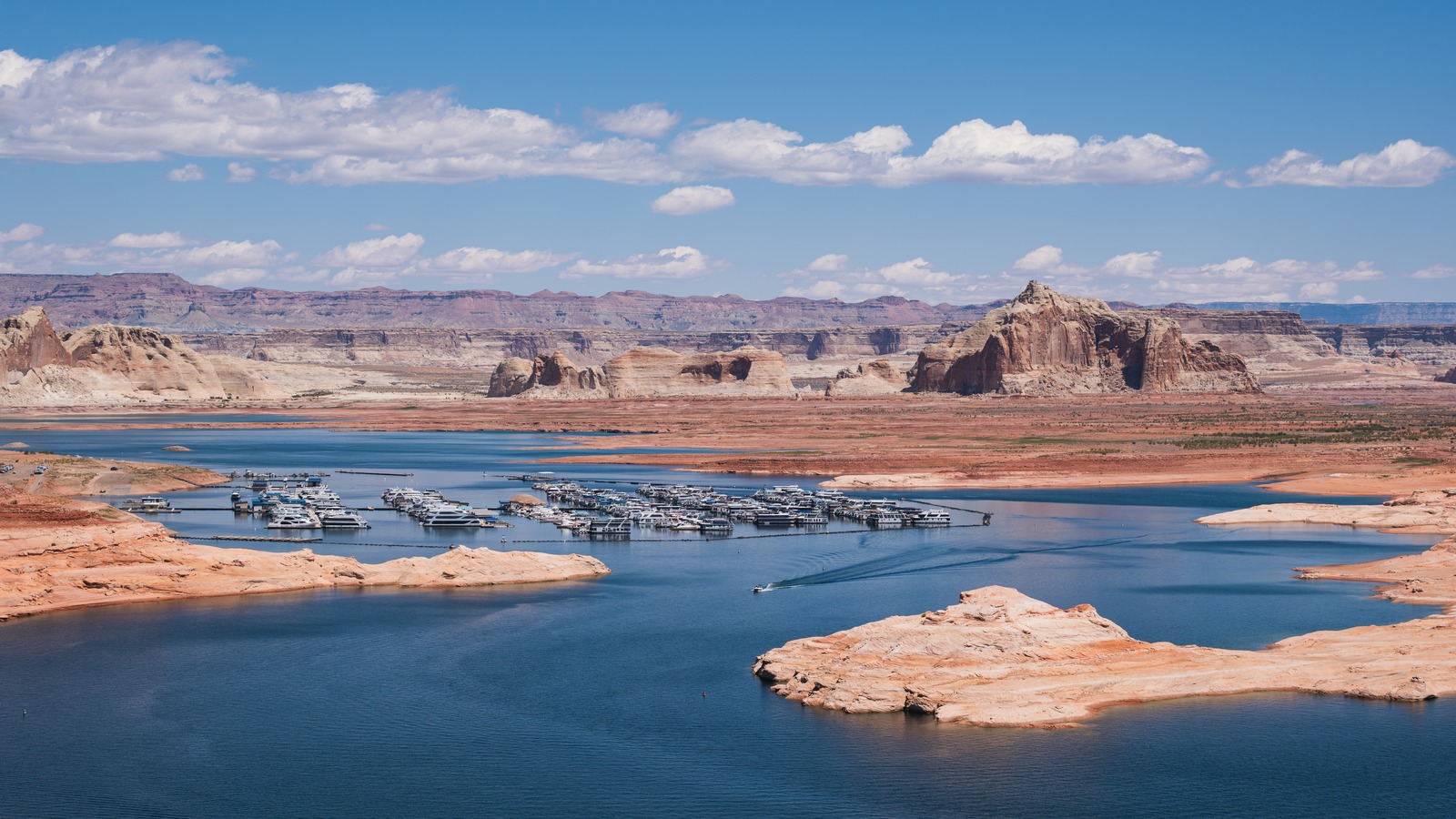 Wahweap Marina and Lake Powell bay near Page, Arizona, with sandstone cliffs beyond the water
