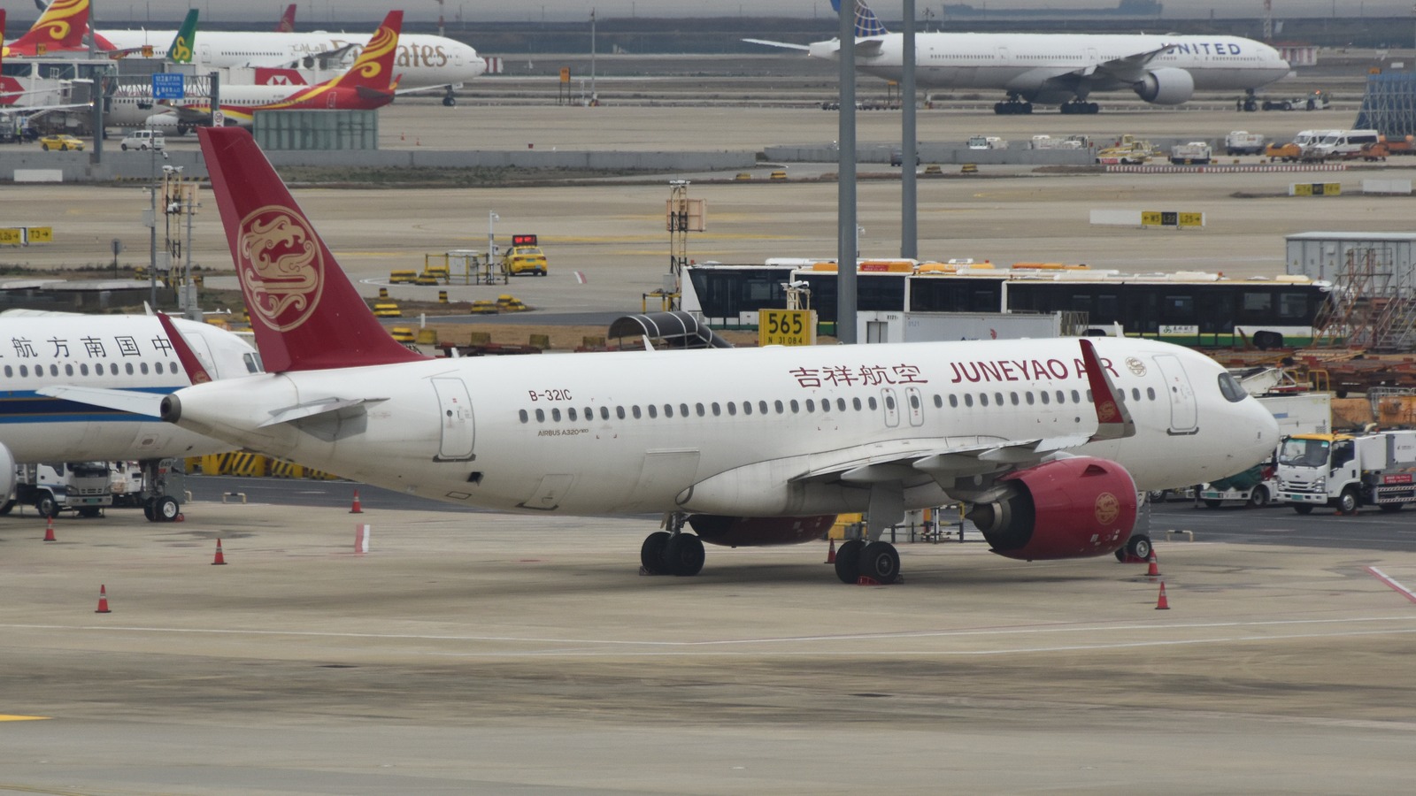 Juneyao Airlines Airbus A320neo B-321C taxiing at Shanghai Pudong Airport in March 2026
