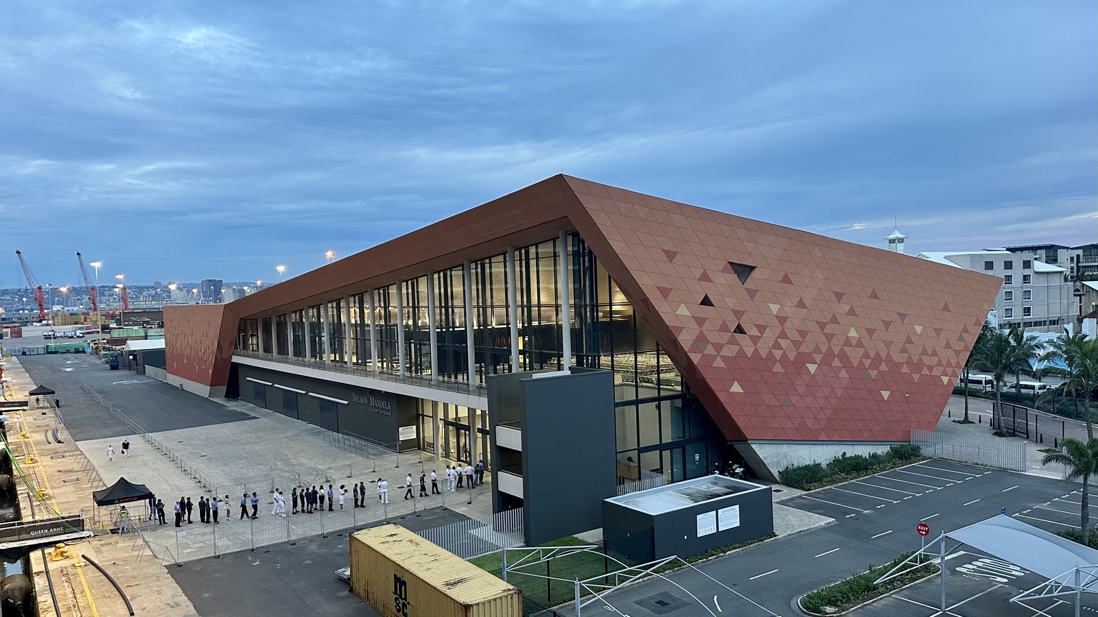 The Nelson Mandela Cruise Terminal building in Durban harbour, with its red triangular facade and the terminal name above the entrance